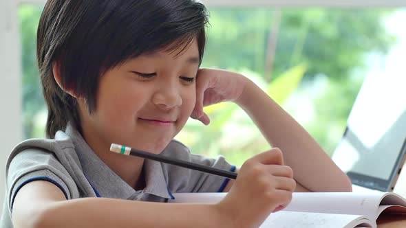 Cute Asian Child Learning Class Study Online With Video Call From Tablet At Home