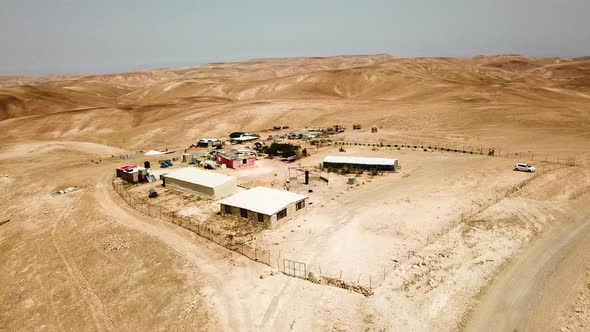 180’ Aerial view of a campsite in the desert