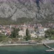 Flying from open sea towards a coastal town - VideoHive Item for Sale