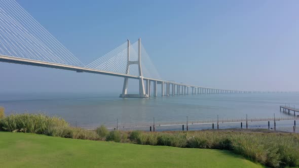 Lisbon Portugal Aerial View Rise Up of the Vasco Da Gama Bridge on a Foggy Beautiful Morning During