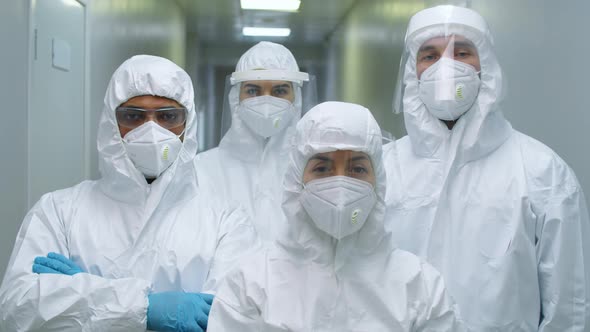 Group of Doctors in Protective Uniforms Posing for Camera