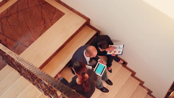 Top View of Project Team Working on Stairs