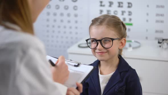 Cute Smiling Girl Waiting Eyeglasses Prescription From Optician, Treatment Tips