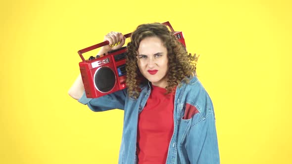 Woman with Red Retro Boombox on Her Shoulder Dancing and Calling To Herself, Slow Motion