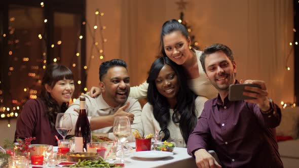 Friends Having Christmas Dinner and Taking Selfie