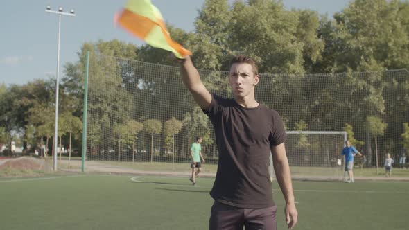 Assistant Referee in Action During Soccer Match