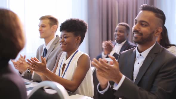 People Applauding at Business Conference