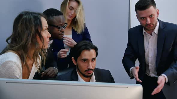 Team of Happy Business People Posing for Photographer Around the Desk