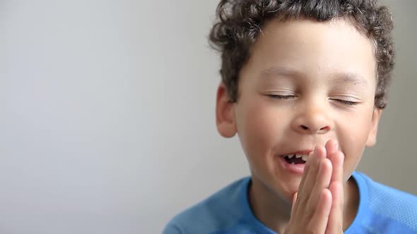 little boy praying to God with hands together stock video