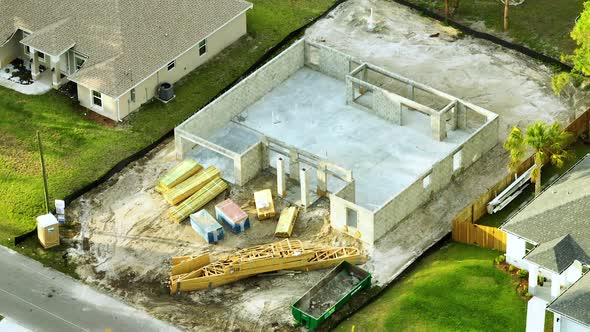 Aerial View of Incompleted Frame of Private Home Under Construction with Brick Concrete Walls Ready