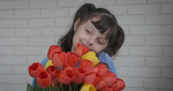 Child with tulips. 