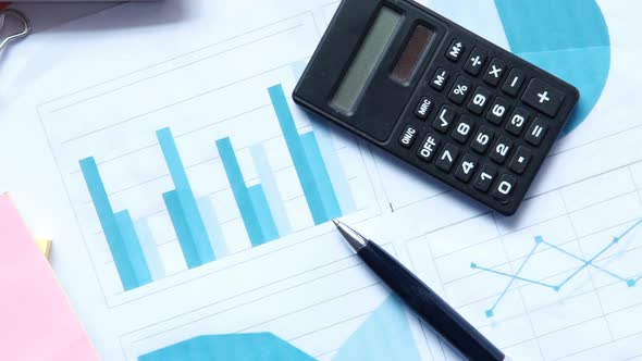 Financial Graph Calculator and Notepad on Table