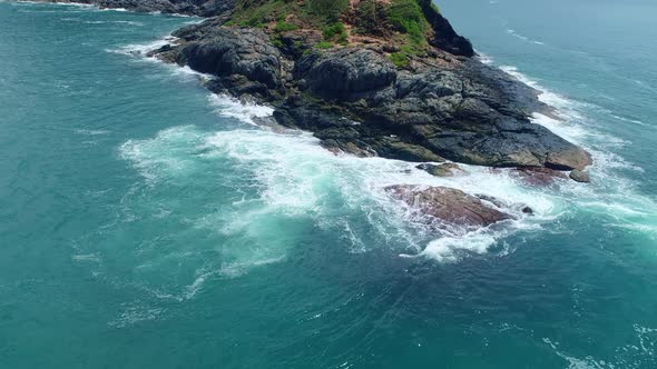 Aerial view Drone camera of seashore rocks in ocean. Beautiful dark sea surface. Amazing sea