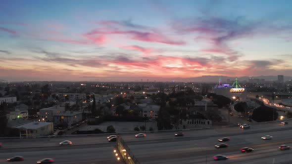 Picturesque Sunset Over the City. Los Angeles Cityscape with a Freeway on the Foreground