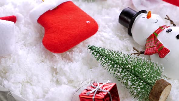 Different Christmas Objects Lay Out on Snow Background