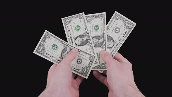 Male Hands Show Several One Dollar Bills with Alpha Channel