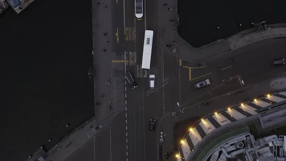 AERIAL: Beautiful Overhead View of Berlin Bridge and River with Tram Train Crossing in Traffic 