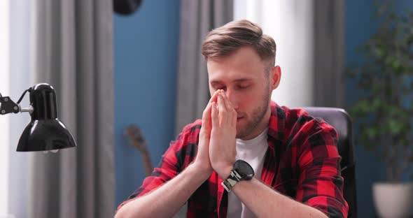 Handsome Focused Young Man with Eyes Closed and Contemplating