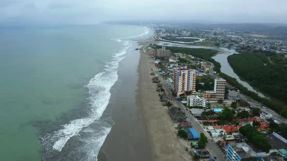 Aerial view, following a beach with many waves 