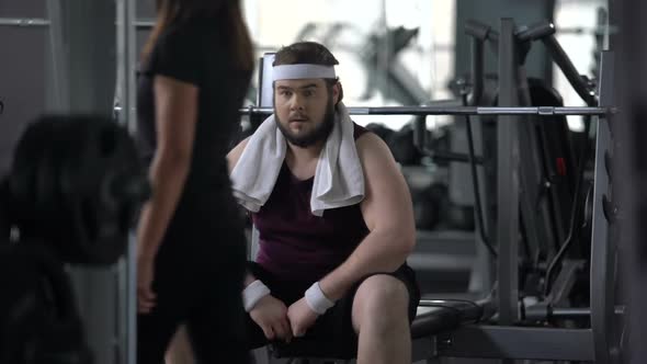 Unconfident Chubby Man in Gym Feeling Upset Because of Excess Weight, Shyness