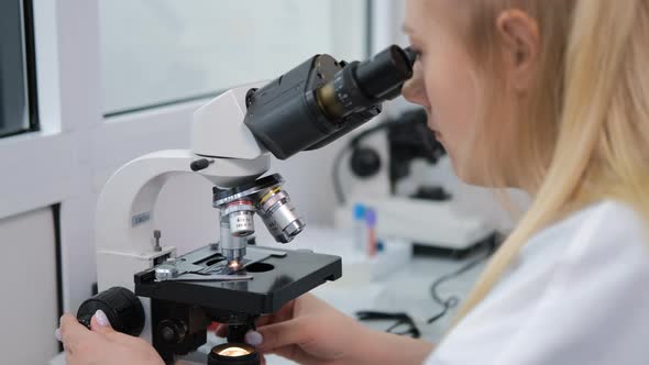 Female Researcher Making Blood Test in a Lab