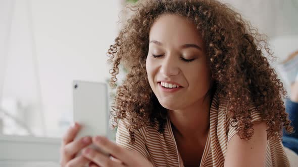 Smiling Young Woman on The Phone