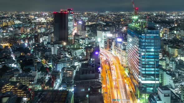 Time Lapse of busy highway and the buildings of Tokyo Japan at night