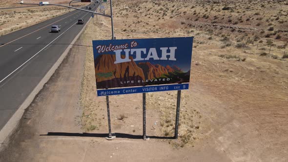 Welcome to Utah Sign Highway on State Border With Nevada USA Drone Aerial View