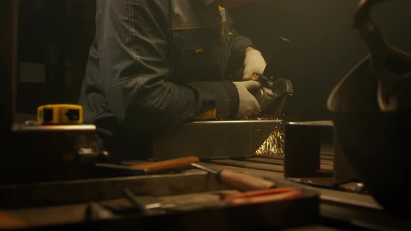 Industrial worker cutting metal