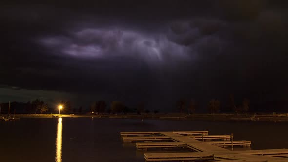 Lightning Time Lapse over pier on lake