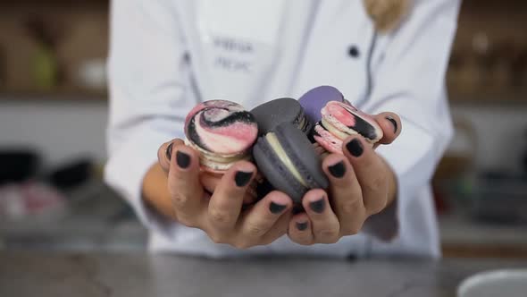 Macaroons in Female Hands