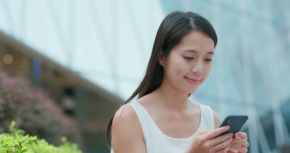 Woman Read on Smart Phone for Online