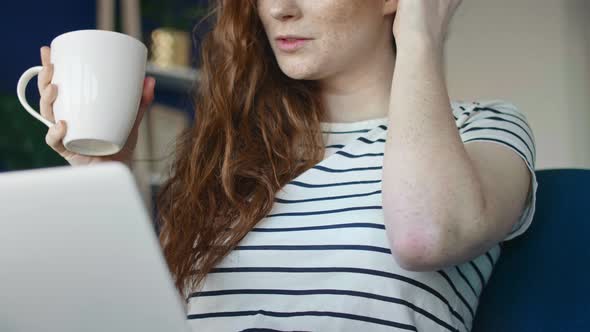 Low angle video of woman  during video conference via computer