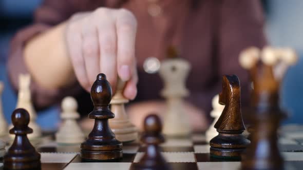 Unrecognizable Woman Playing Chess