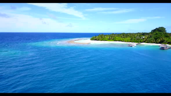 Aerial drone view scenery of tropical tourist beach trip by turquoise water with white sandy backgro