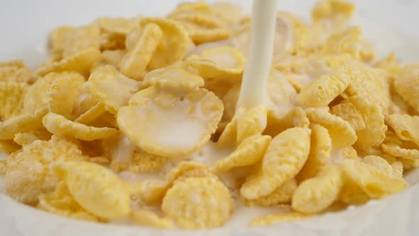 Pouring Milk on Corn Flakes. Slow Motion