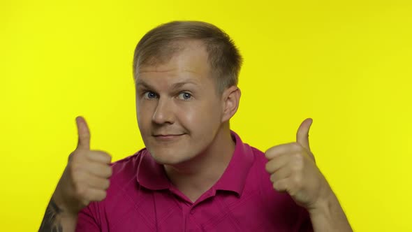 Portrait of Caucasian Man Posing in T-shirt. Smiling Handsome Guy Show Thumbs Up. People Emotions