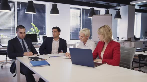 Workers Sitting in Office and Making Brainstorming Research