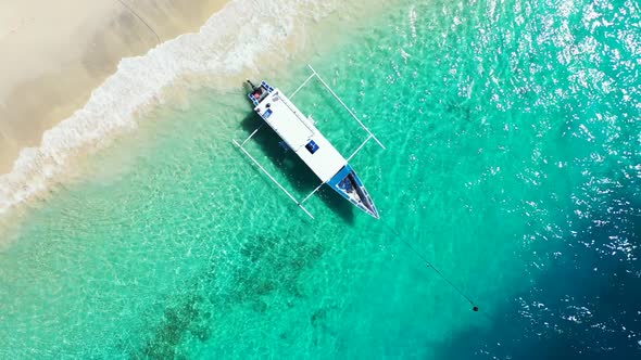 Aerial flying over tourism of paradise bay beach voyage by turquoise sea and white sand background o