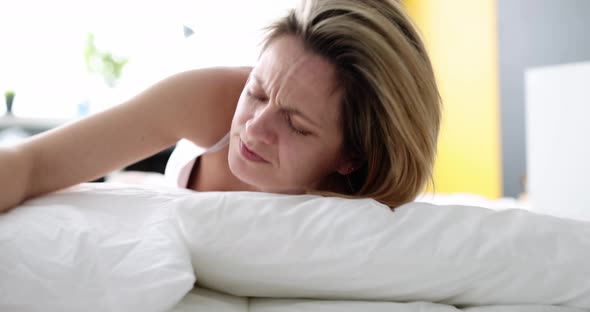 Woman Wakes Up Screaming and Holding Alarm Clock