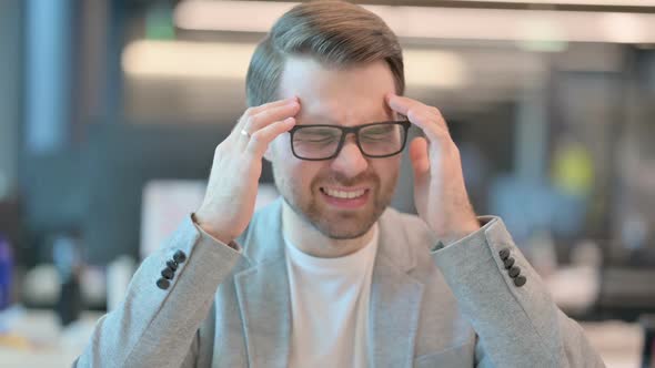 Portrait of Casual Man having Headache