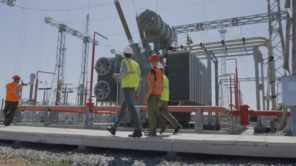 Inspectors Examining Power Station Equipment