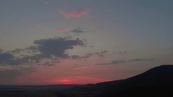 Silhouette of Mountain Range Under Sunset Sky