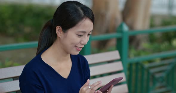 Woman Use of Mobile Phone in The Park