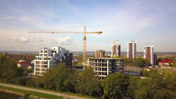 Aerial view of high residential apartment buildings under construction. Real estate development