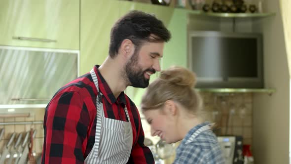 Cheerful Couple on Kitchen Background