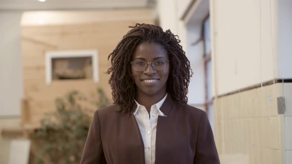 Front View of Confident Businesswoman Looking at Camera