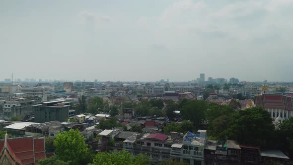 4K Urban landscape shot of a panoramic view of Bangkok, Thailand on a sunny day, from the top of the