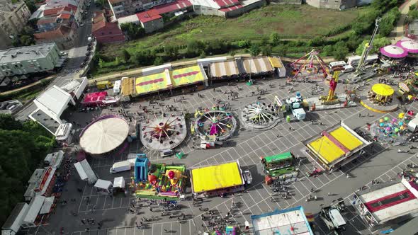 People on Fairground in City Top View