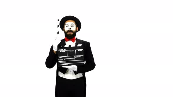Man Mime Sneezes Using the Movie Clapper on White Background